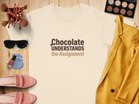 Cream t-shirt with "Chocolate Understands the Assignment" text.