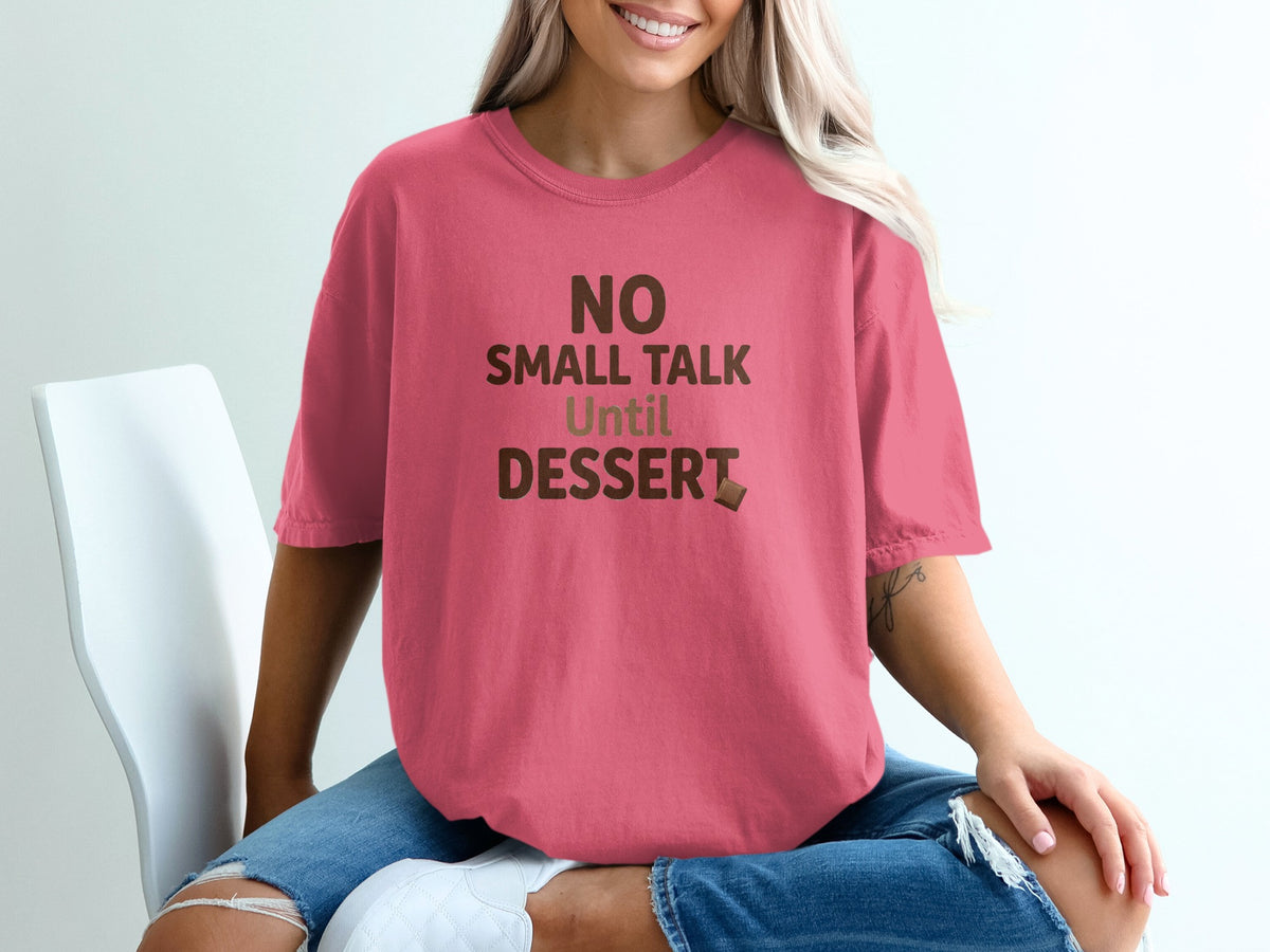 Pink t-shirt with brown text "NO SMALL TALK Until DESSERT" and a chocolate bar.
