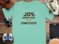 Mint t-shirt with "Joy doesn't have to be complicated" text.