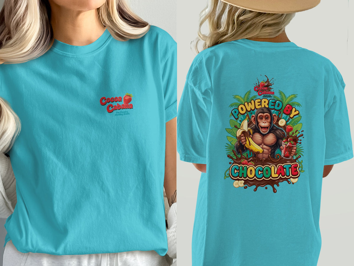 Woman wearing a turquoise t-shirt with a "Cocoa Cabana" logo and a monkey graphic.