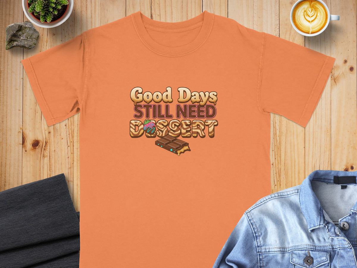 Orange t-shirt with "Good Days Still Need Dessert" text and chocolate illustration.