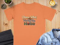 Orange t-shirt with "Choose What Melts the Noise" text and chocolate graphic.