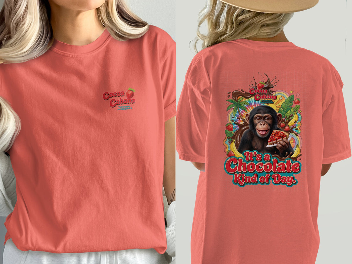 Coral t-shirt with "Cocoa Cabana" logo and monkey graphic saying "It's a Chocolate Kind of Day."