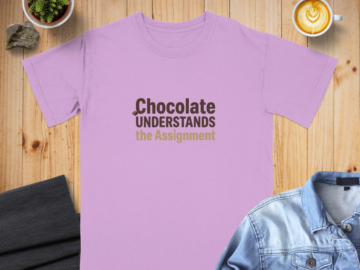 Light purple t-shirt with "Chocolate UNDERSTANDS the Assignment" text.