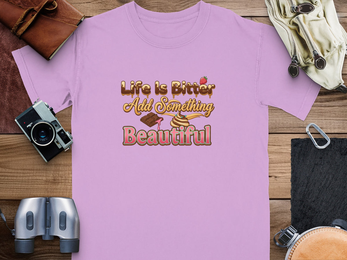 Pink t-shirt with "Life Is Bitter Add Something Beautiful" text and chocolate graphics.