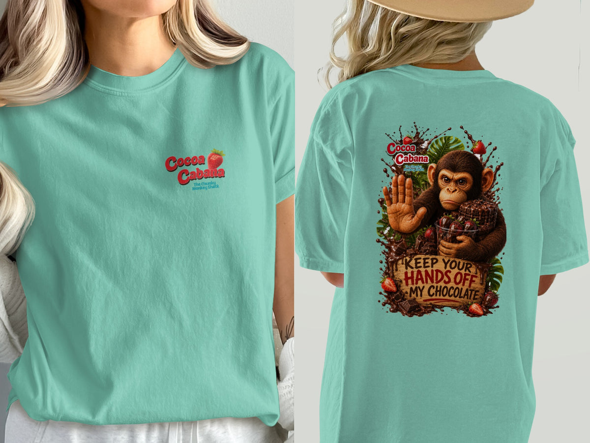 Mint green t-shirt with "Cocoa Cabana" logo and monkey graphic reading "Keep Your Hands Off My Chocolate".