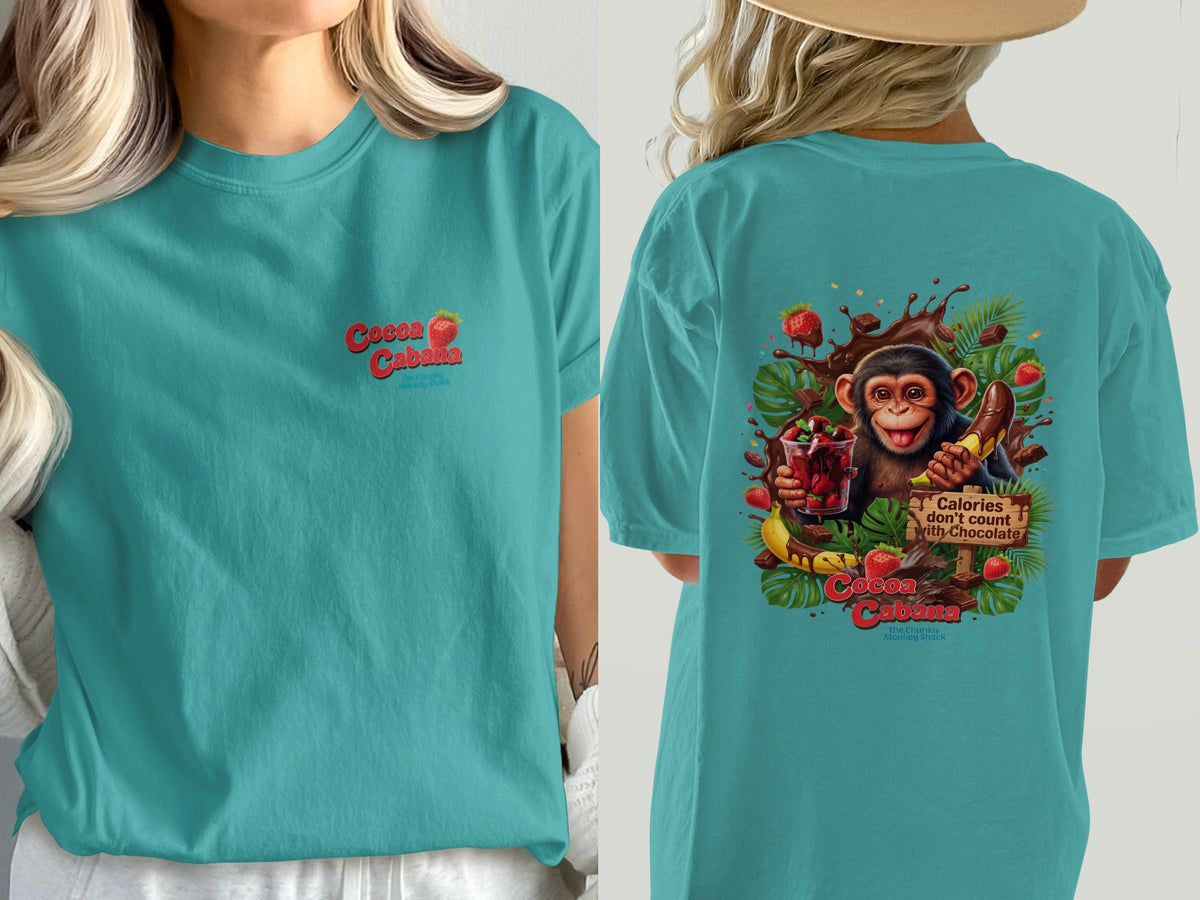 Teal t-shirt with "Cocoa Cabana" logo and monkey graphic with chocolate.