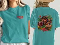 Teal t-shirt with "Cocoa Cabana" logo and monkey graphic with chocolate.