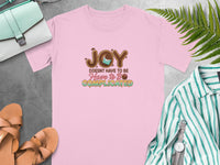 Pink t-shirt with "JOY DOESN'T HAVE TO BE Have to Be COMPLICATED" text and chocolate design.